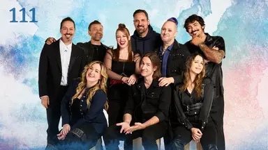 Thumbnail for episode 111. A group photo of Sam, Liam, Marisha, Travis, Taliesin, Robbie Daymond, Ashley, Matt, and Laura. They are posed with their arms on each other’s shoulder, smiling widely. They are dressed in mostly black and blue with a white shirt on Sam and some red accents on Marisha. They stand against a colorful backdrop with splashes of blues, greens, reds, and oranges over white.